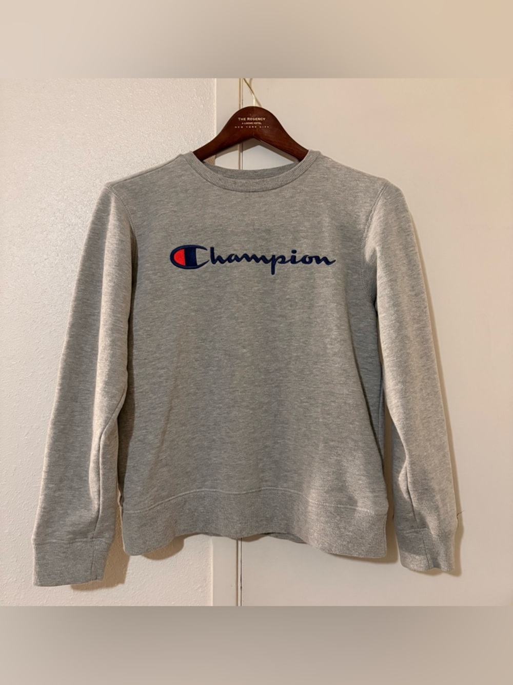 Champion Gray Large Crewneck W/ Champion across the front & emblem on the sleeve